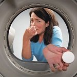 Запах в стиральной машине: что делать?